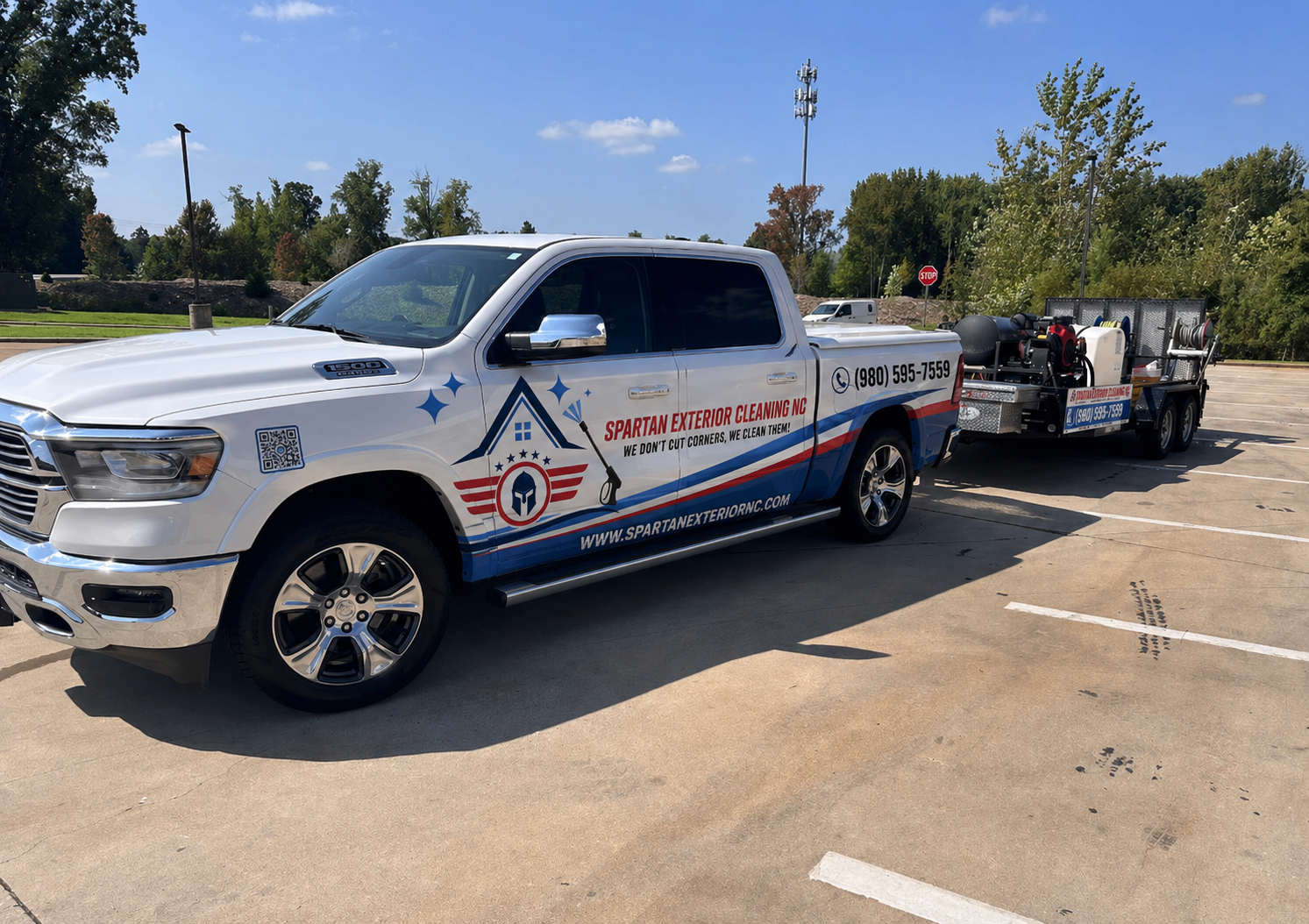 Spartan Exterior Cleaning branded truck and pressure washing trailer
