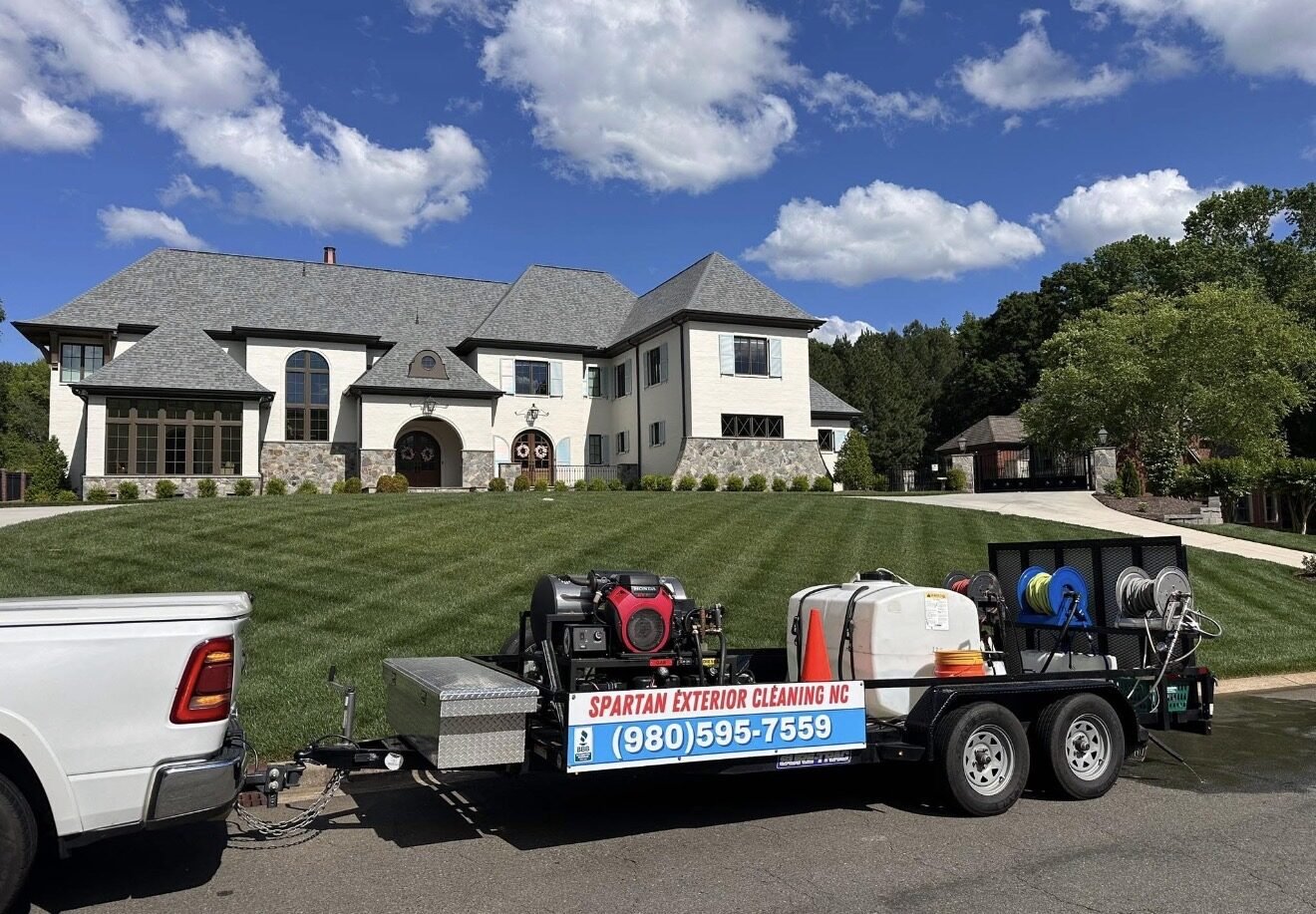 Spartan Exterior Cleaning truck and professional trailer at a Lake Norman home